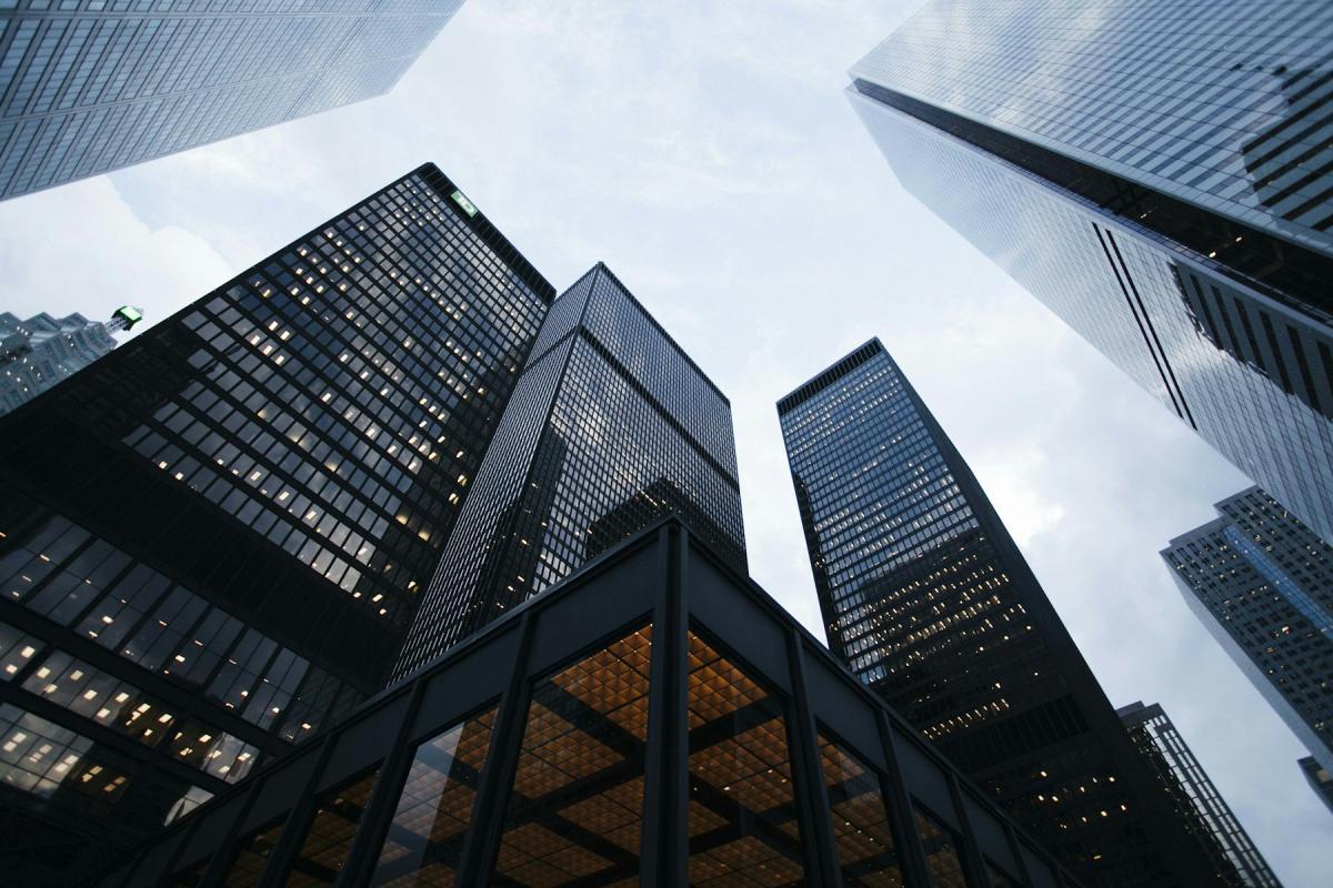 Glass commercial building design rising towards the sky