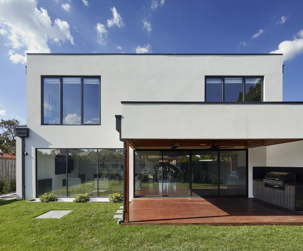 Modern home positioned on its site with landscaped lawn and open frontage Modern home positioned on its site with landscaped lawn and open frontage