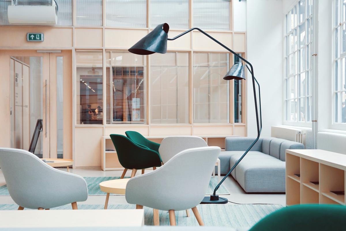 Collaborative office interior with lounge seating and task lighting