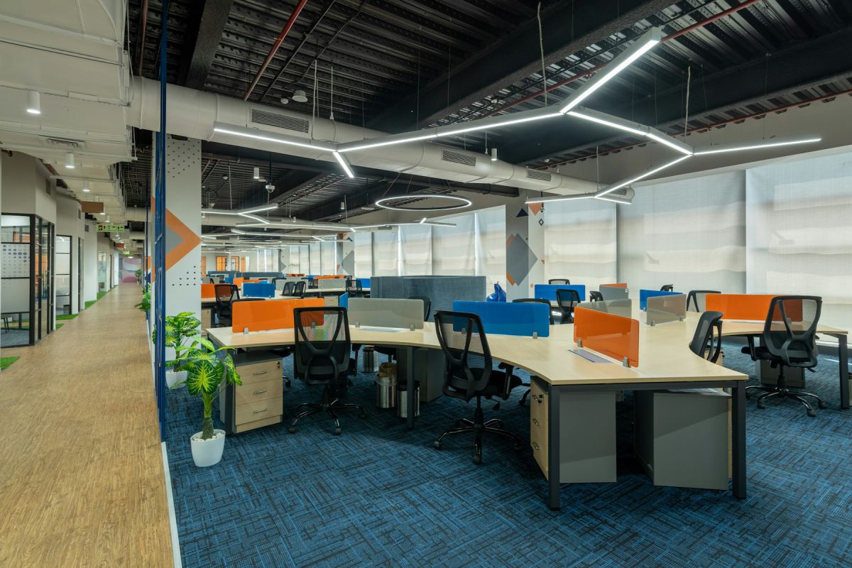 Open-plan office interior with workstations, blue carpet and linear lighting — HR DES., Ameerpet Open-plan office interior with workstations, blue carpet and linear lighting — HR DES., Ameerpet