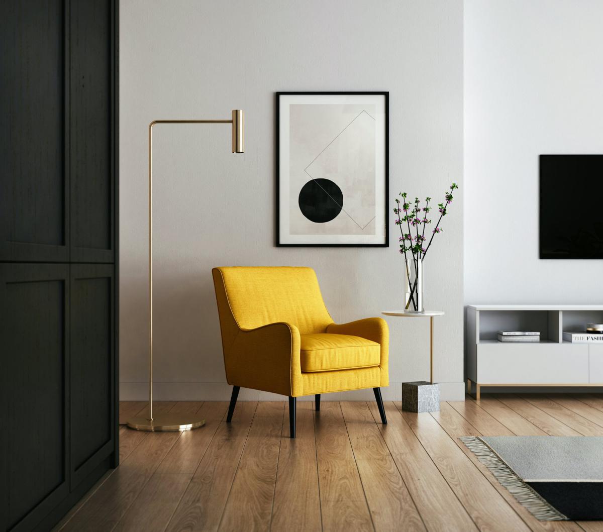 Living room interior with yellow accent chair and framed artwork