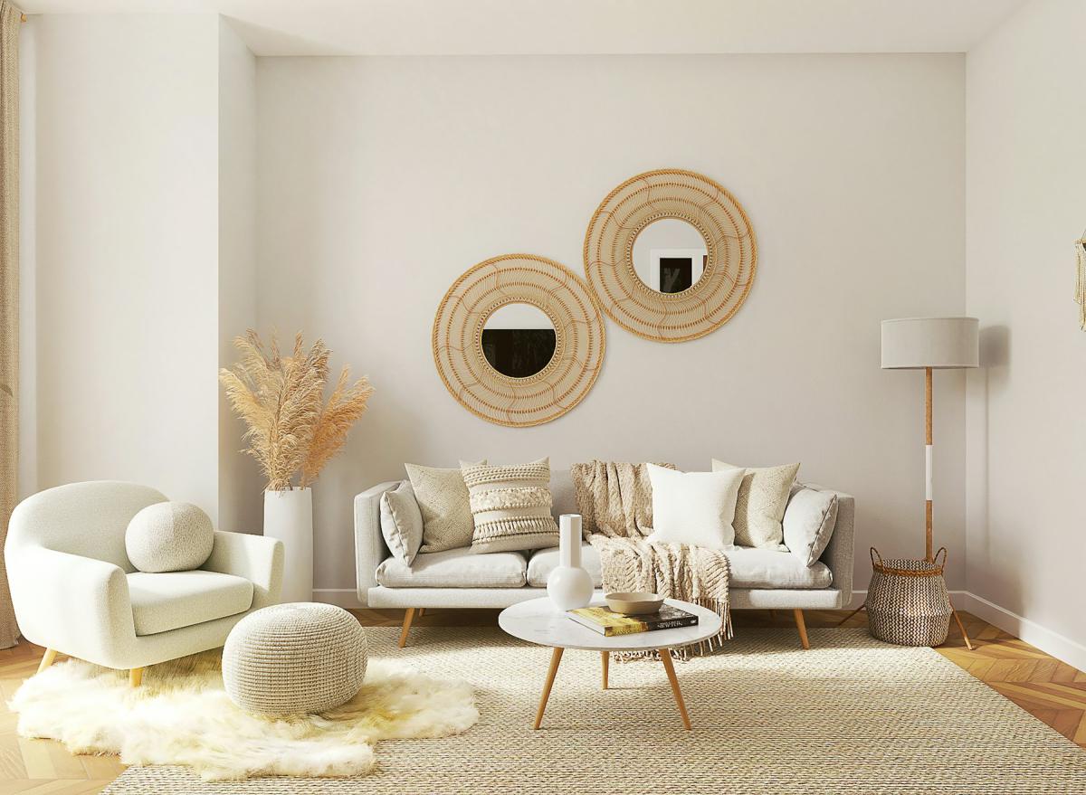 Contemporary living space with curved furniture and round mirrors Contemporary living space with curved furniture and round mirrors