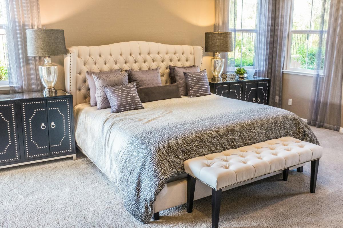 Luxury bedroom design with tufted headboard and classic detailing