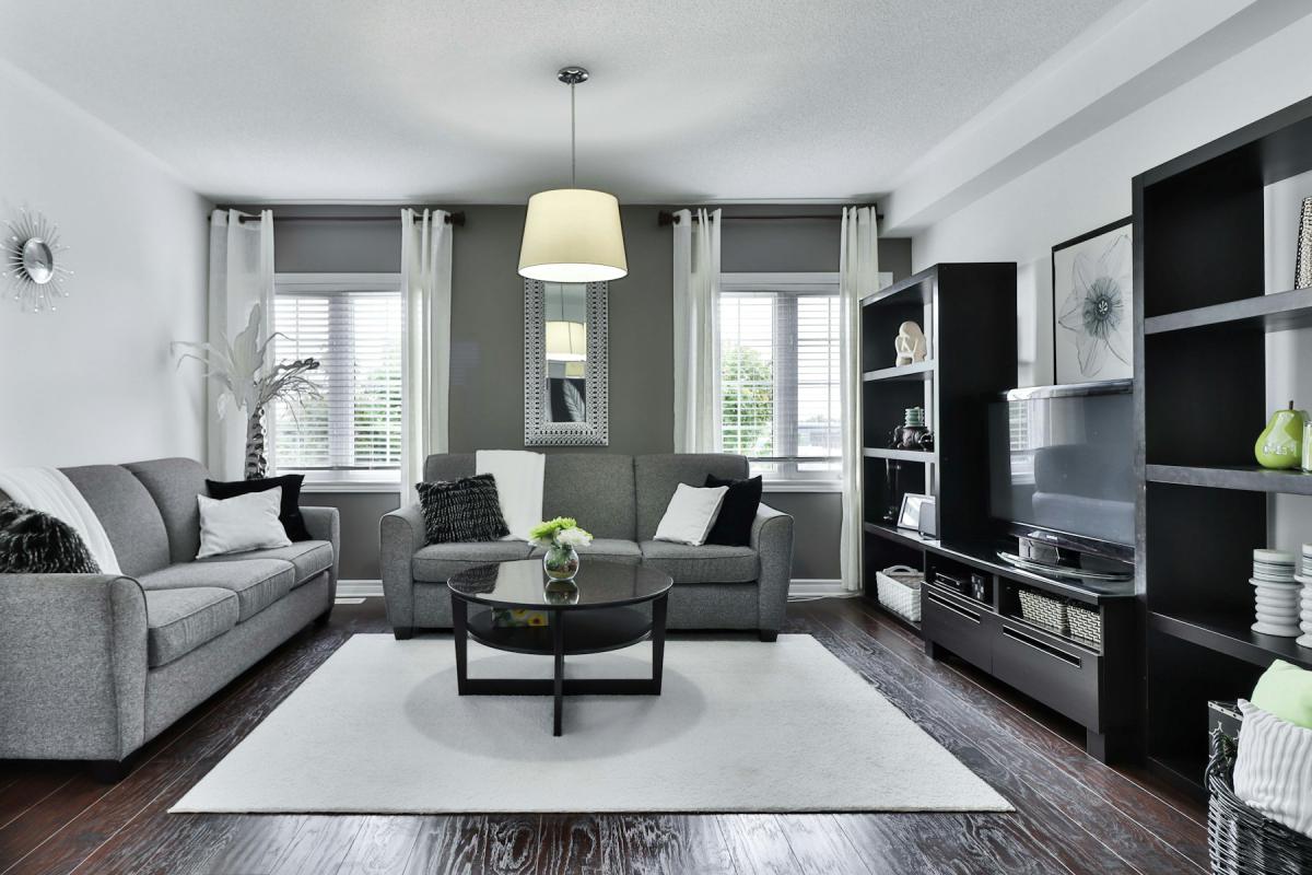 Premium apartment living room with grey upholstery and built-in shelving
